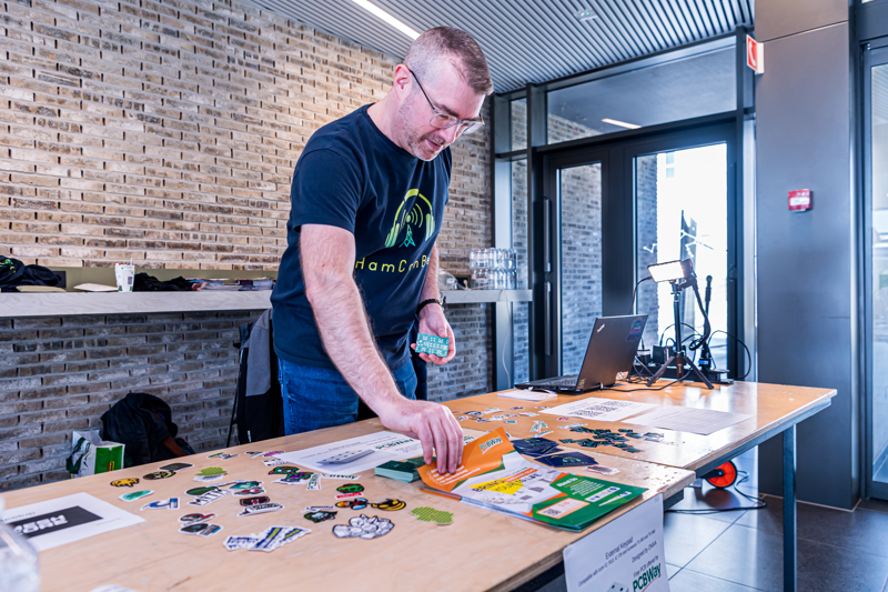 Demo table at HamCon Belgium. Visitors could see the project hardware up close and get a practical explanation of the KiCad-to-manufacturing workflow.